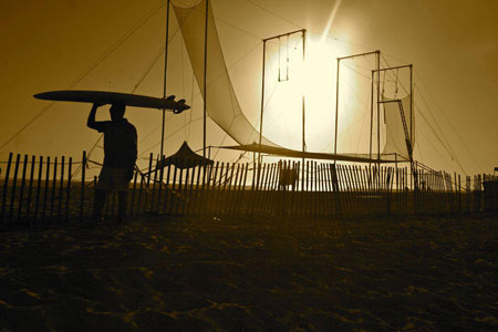 trapeze_on_beach_with_surfer_sunset